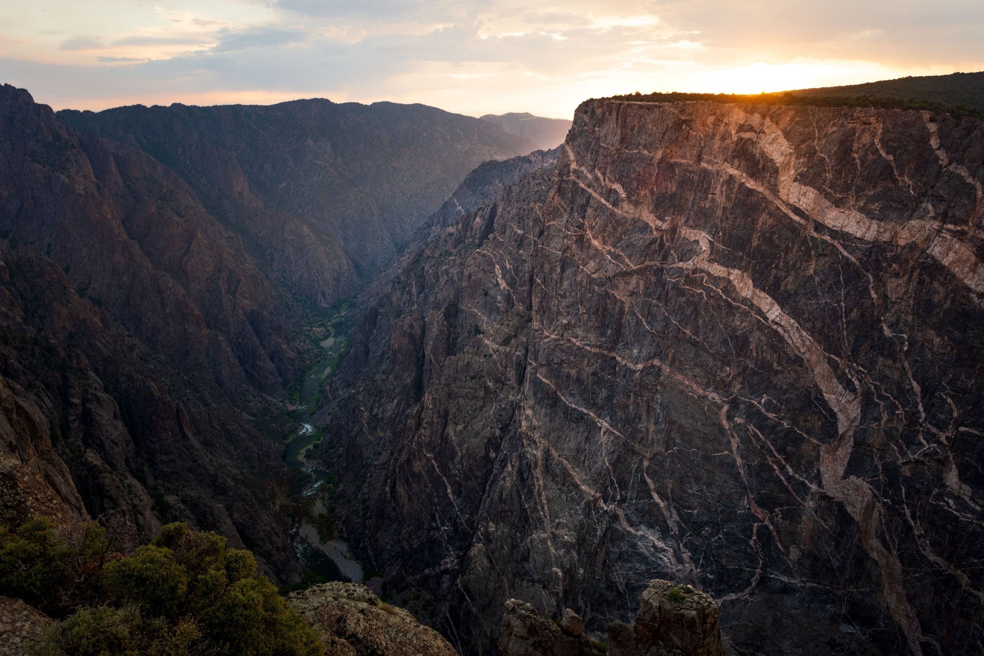 Sheer cliffs of the Black Canyon of the Gunnison at sunset in Black Canyon of the Gunnison National Park, Colorado