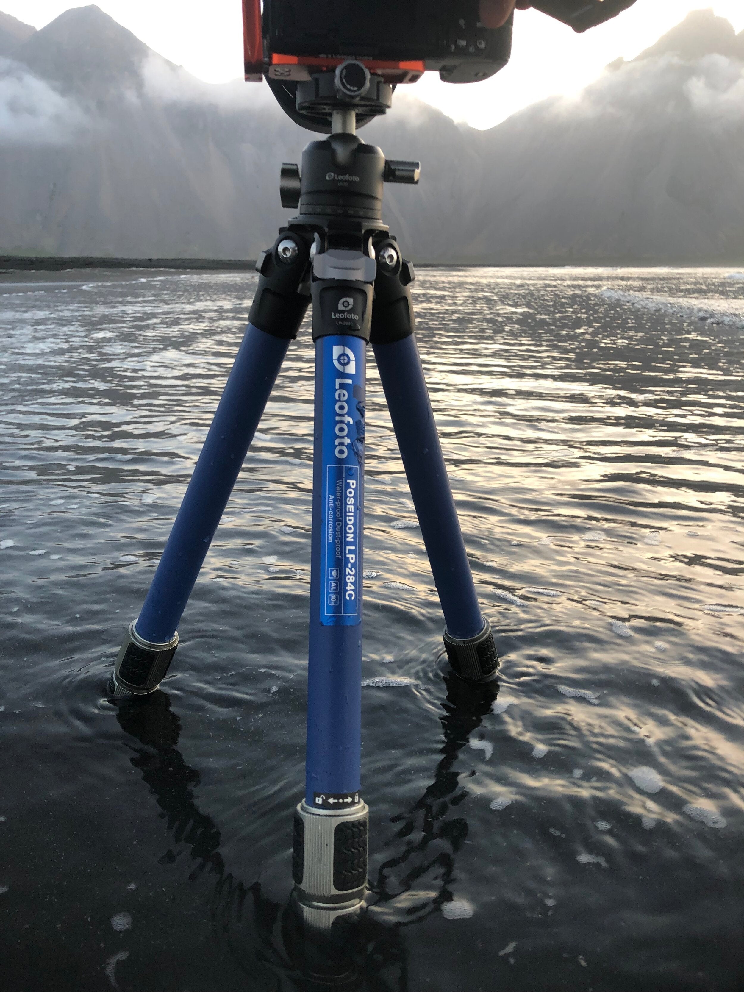 Leofoto Poseidon LP-284C tripod standing in shallow water on Icelandic shoreline at sunrise
